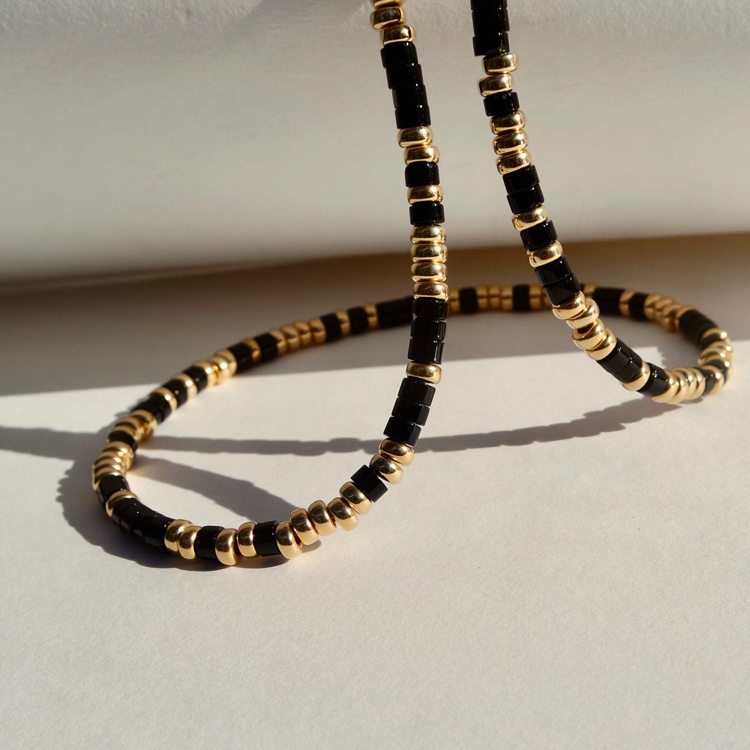 Onyx and on sale gold bead necklace